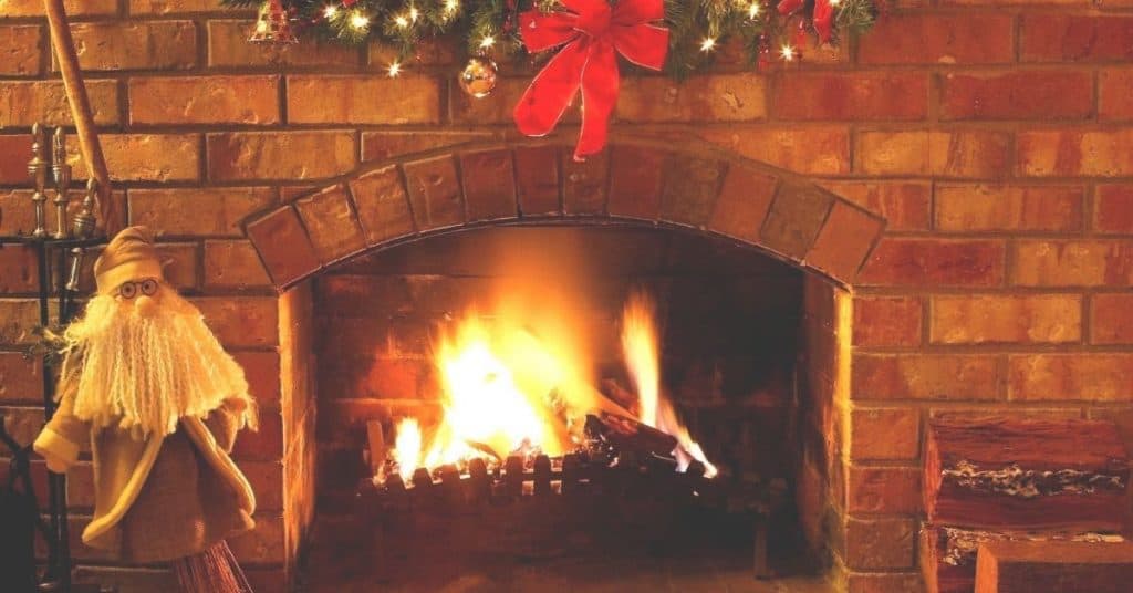 Burning wood in a fireplace - Christmas Traditions and Customs - What is a Yule Log - Open for Christmas