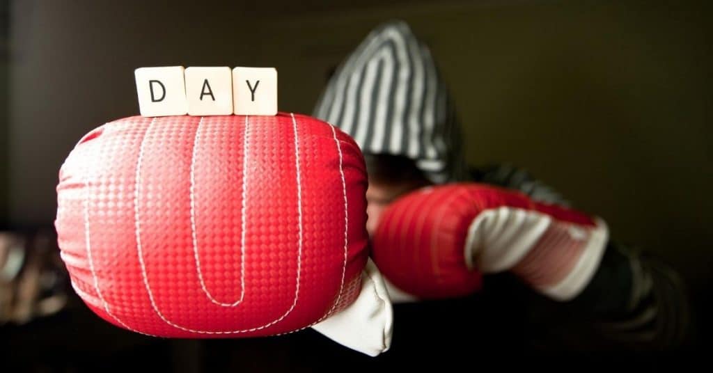 Day Scrabble Letters Balanced on Man Wearing Boxing Gloves - Open for Christmas