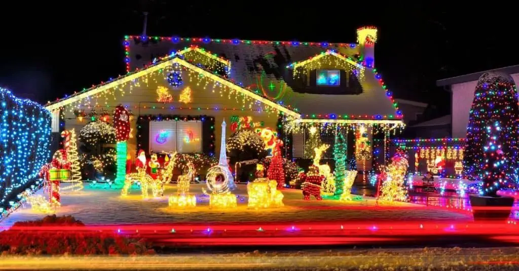 Outdoor LED warm Christmas lights on a house - Open for Christmas